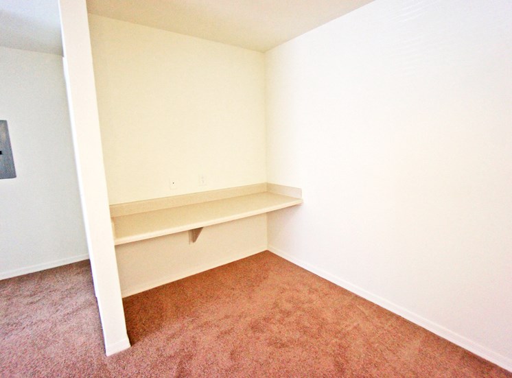 Built in desk area in carpeted dinning room